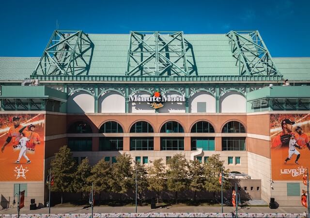 a baseball stadium with a large sign on the side of it in Minute Maid Park, Houston tx